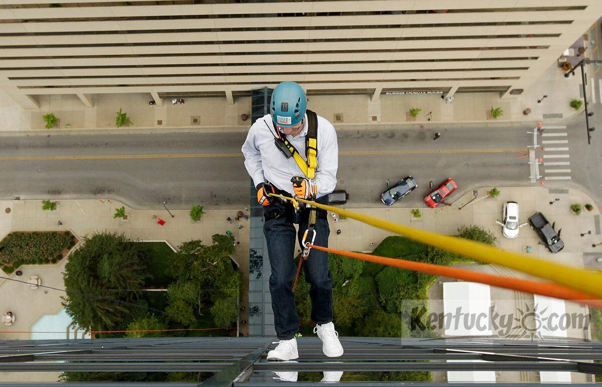 Herald-Leader columnist Tom Eblen rappelled down the side of the Lexington Center on Wednesday during Brave the Blue II in downtown Lexington.