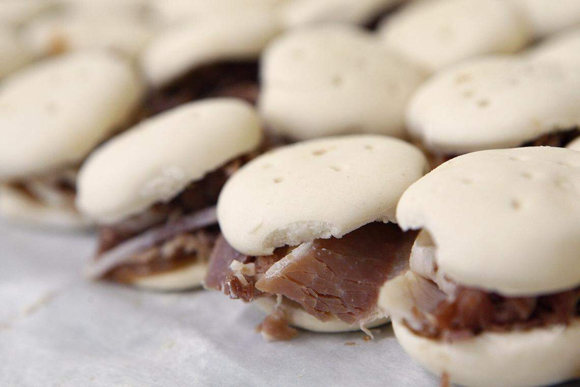 Chef Ouita Michel served these beaten biscuits, made with buttermilk, with apple butter and country ham. They are not hard to make but tricky to do without a special roller called a biscuit brake.