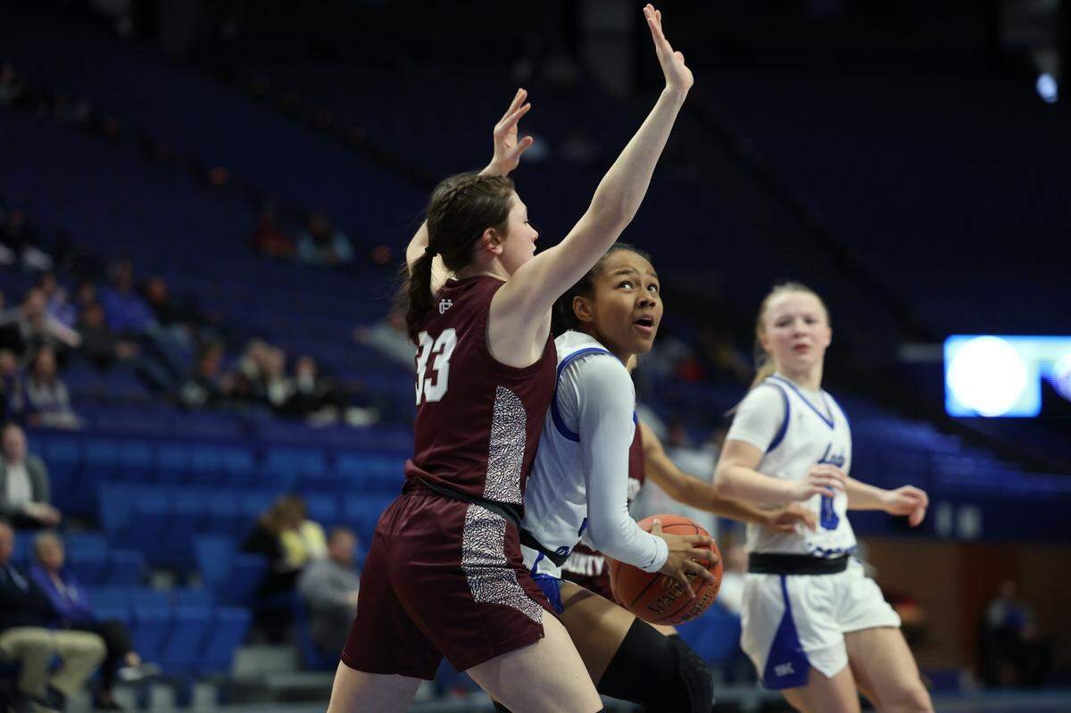 Simon Kenton’s Haylie Webb looks for space to get off a shot over Henderson County’s Brooklyn Gibson on Thursday night.