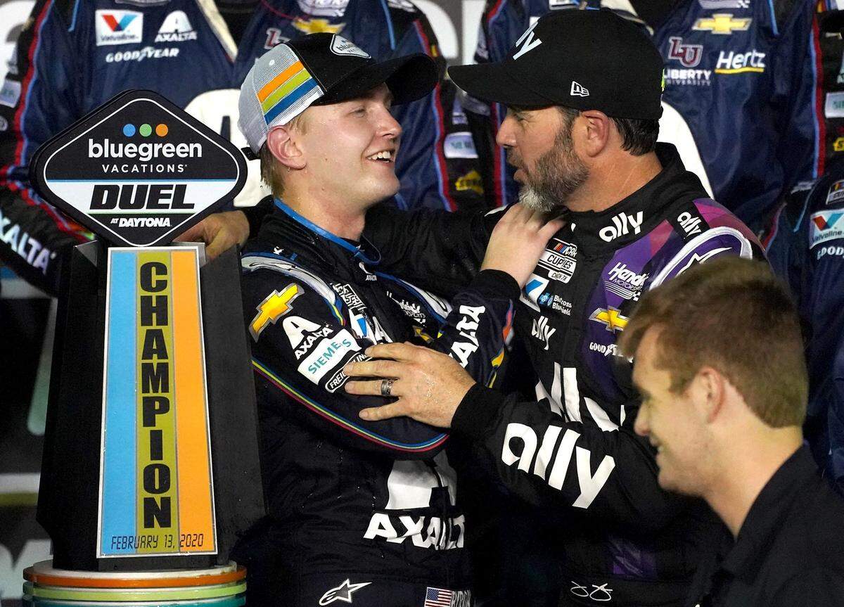 NASCAR driver William Byron, left, was congratulated by Hendrick Motorsports teammate Jimmie Johnson, right, after winning the second qualifying race for the 2020 Daytona 500 at Daytona International Speedway in February.