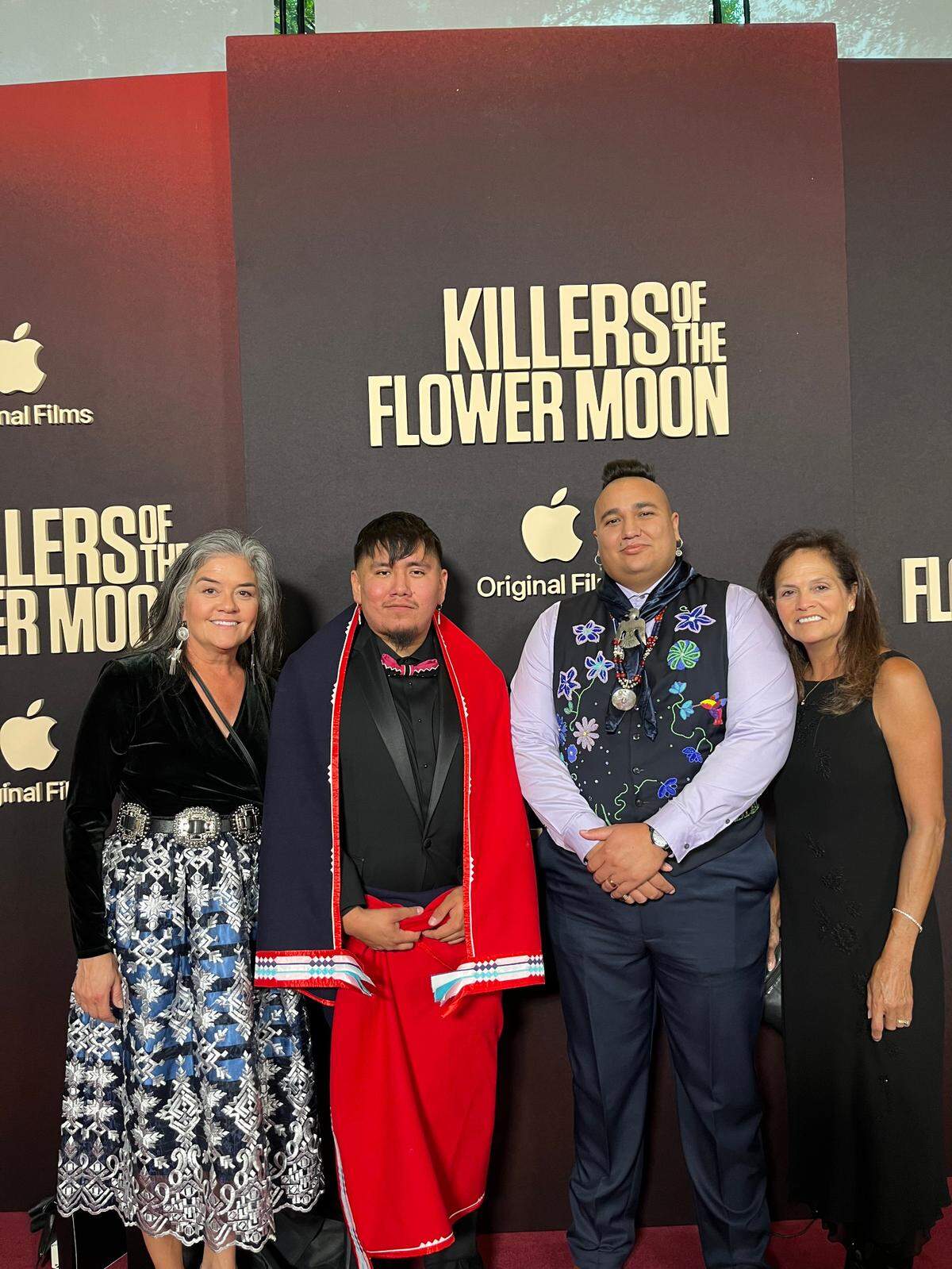 Lou Anna Red Corn, her nephew T.J. Redcorn who worked on the set, nephew Christopher Cote who taught the actors to speak Osage for the movie and sister Rox Anna Red Corn were photographed at the New York premiere for “Killers of the Flower Moon.” Lou Anna Red Corn said she chose to wear a dress designed by her nephew Dante Biss-Grayson.
