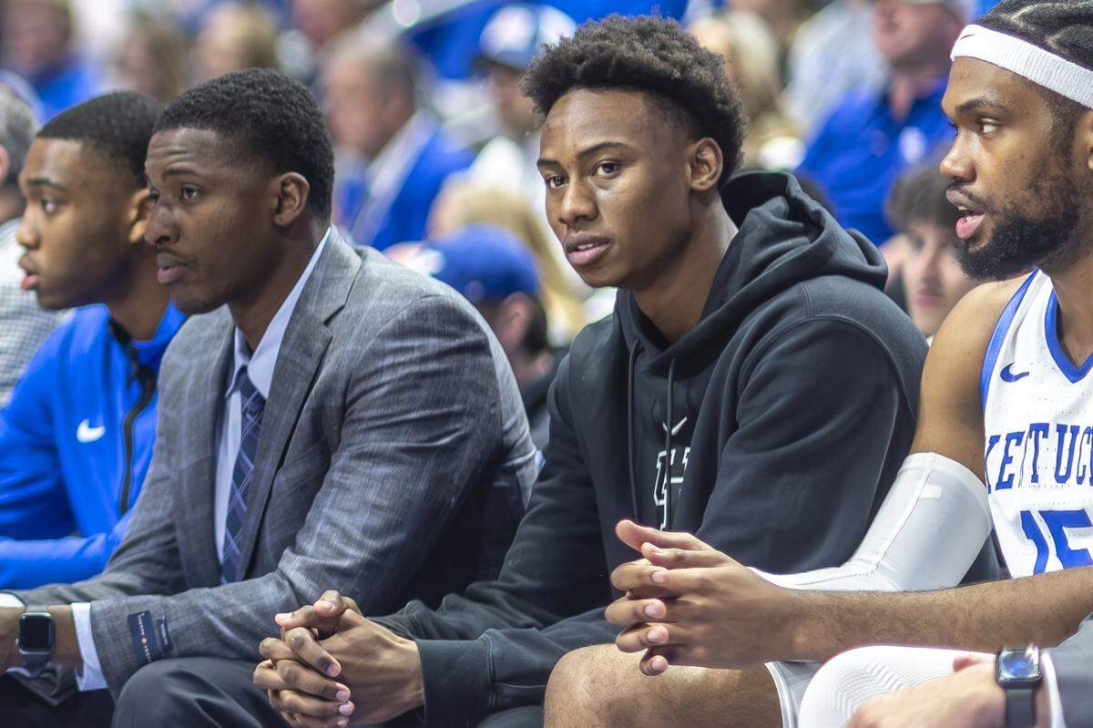 Kentucky guard Jaxson Robinson, second from right, watched Saturday’s game against Auburn from the bench at Rupp Arena. Coach Mark Pope announced after the game that Robinson will miss the rest of the season with a wrist injury.