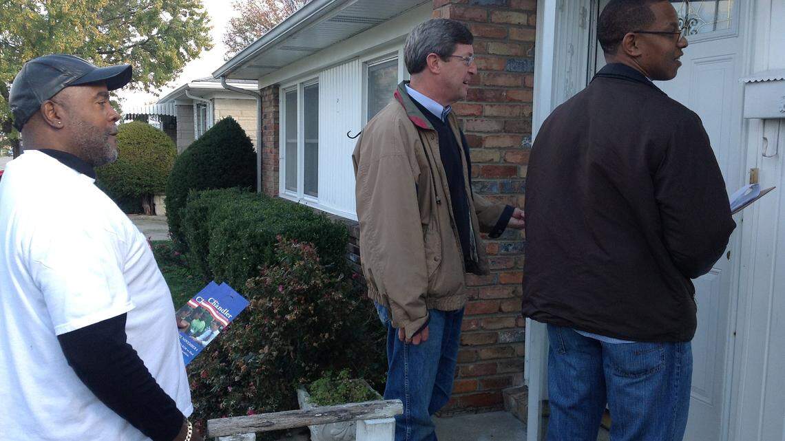 U.S. Rep. Ben Chandler, center, knocked on doors in North Lexington with Michael Haskins, left, and Councilman Chris Ford Sunday.
