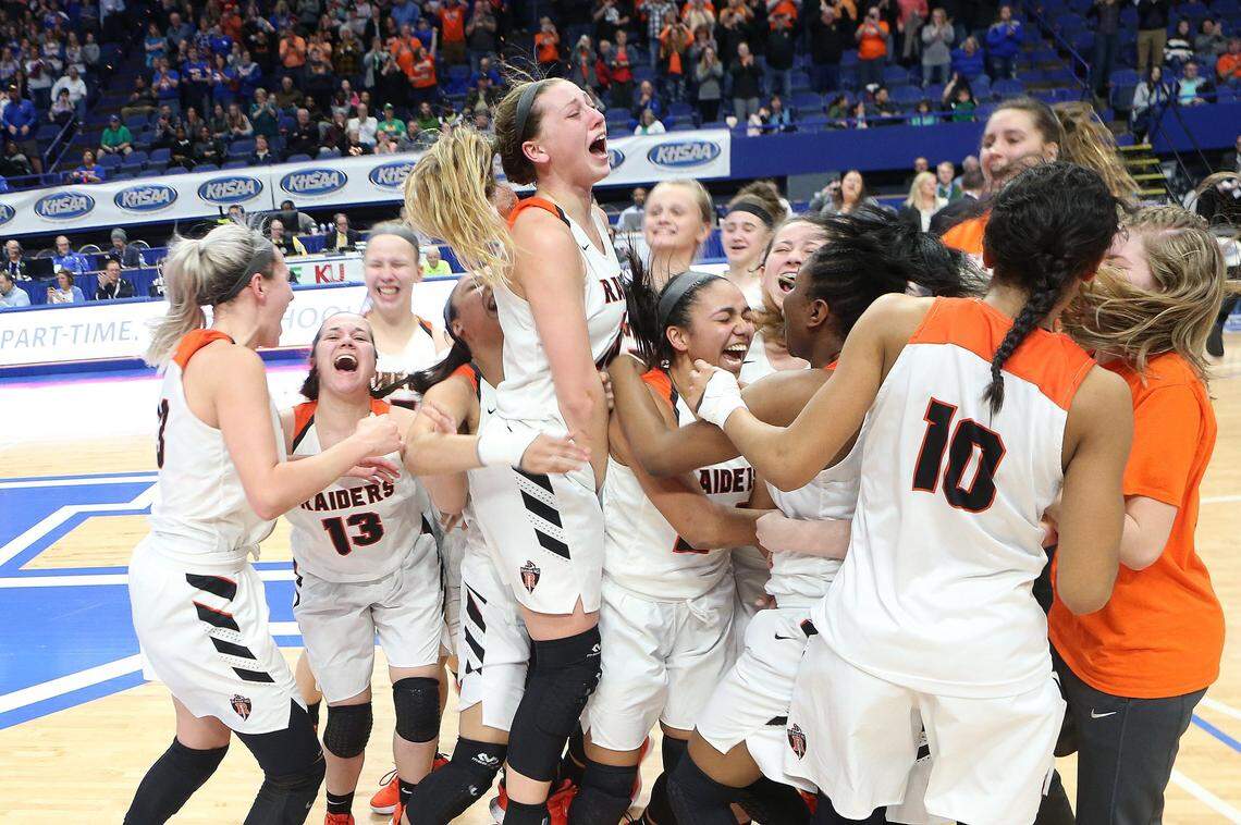 Ryle’s Maddie Scherr and the Lady Raiders celebrated after the beat Southwestern 63-48 at Rupp Arena in the 2019 Kentucky Girls State Tournament championship game.