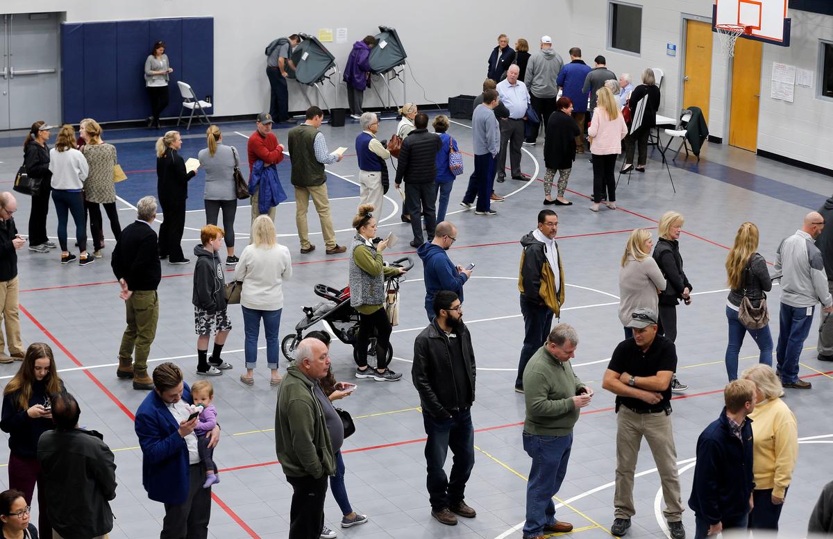 Long lines of voters waited to vote Tuesday morning at the precincts located in Macedonia Christian Church, 4551 Winchester Road in Lexington. The church, which is the location for three voting precincts, Greenbrier, Manny Oaks Park and Shaker Run, was experiencing a heavy voter turnout.