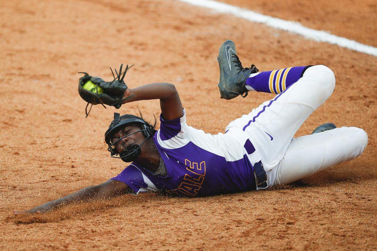 Male’s Jasmine Miller (16) dives to catch a ball during the KHSAA State Softball Tournament championship against the Warren East at John Cropp Stadium in Lexington, Ky., Saturday, June 15, 2019. Male beat Warren East 6-1. 