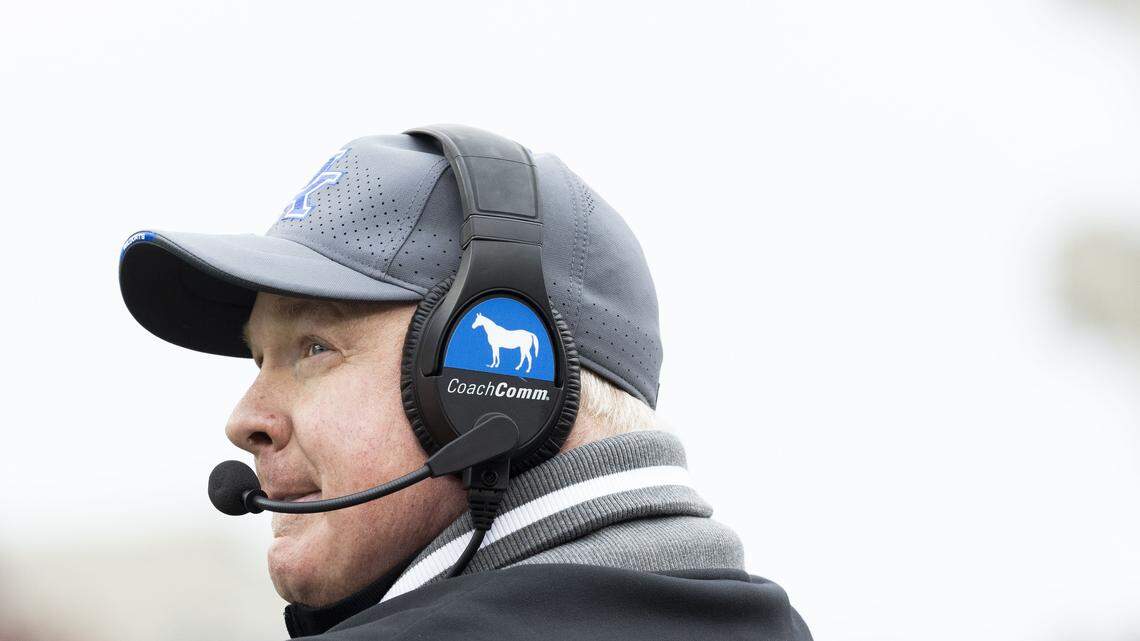 Kentucky head coach Mark Stoops watches from the sidelines during Saturday’s game against Louisville.