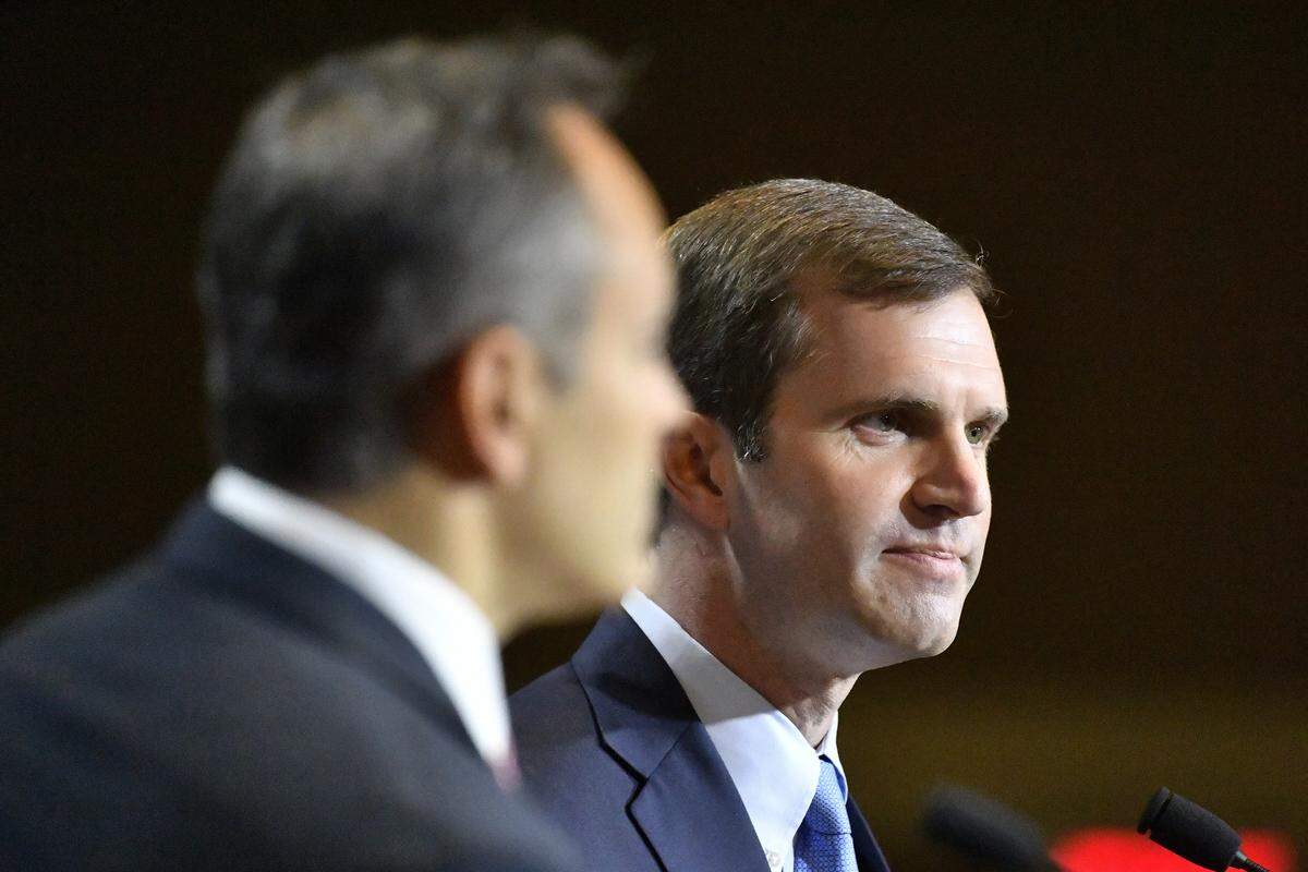Kentucky Attorney General and Democratic candidate for Governor Andy Beshear, right, responds to a question as Kentucky Governor and Republican candidate Matt Bevin looks on during a debate in Paducah, Ky., Thursday, Oct. 3, 2019.