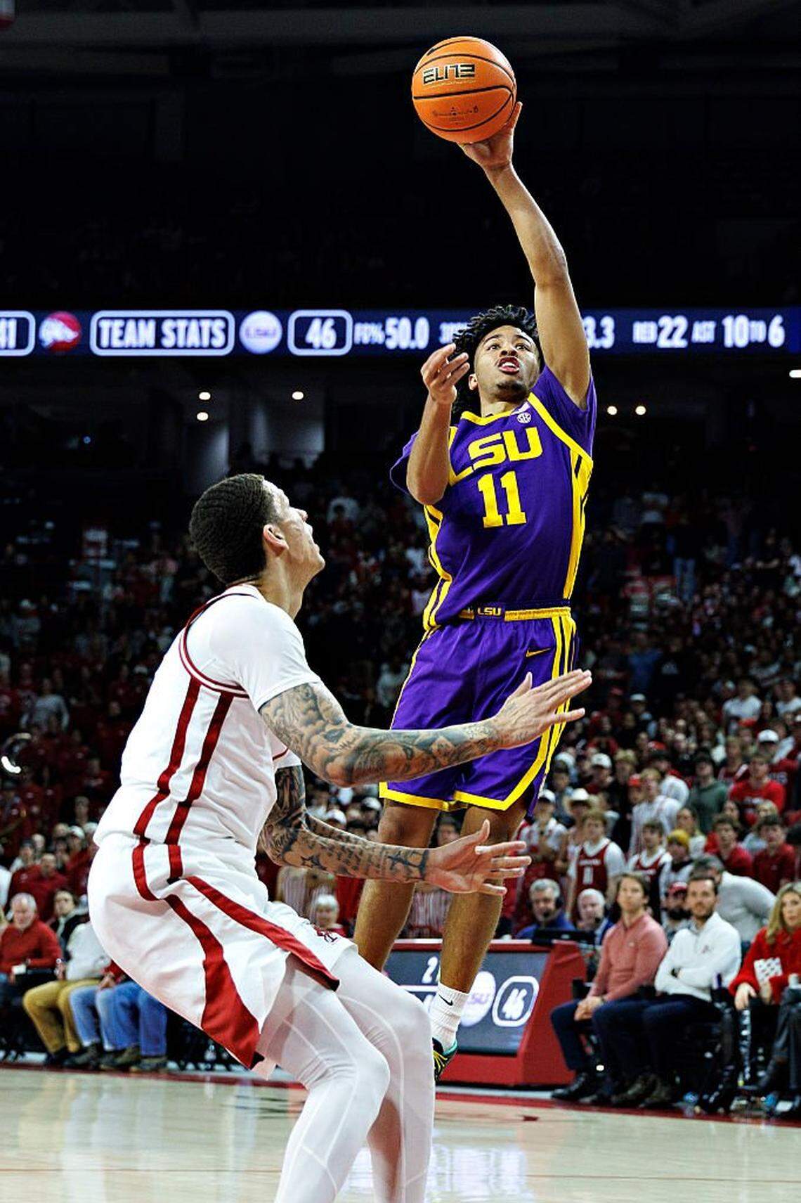 FAYETTEVILLE, ARKANSAS - JANUARY 24: Dedan Thomas Jr. #11 of the LSU Tigers goes up for a shot in the second half against Trevon Brazile #7 of the Arkansas Razorbacks at Bud Walton Arena on January 24, 2026 in Fayetteville, Arkansas. The Razorbacks defeated the Tigers 85-81. (Photo by Wesley Hitt/Getty Images)
