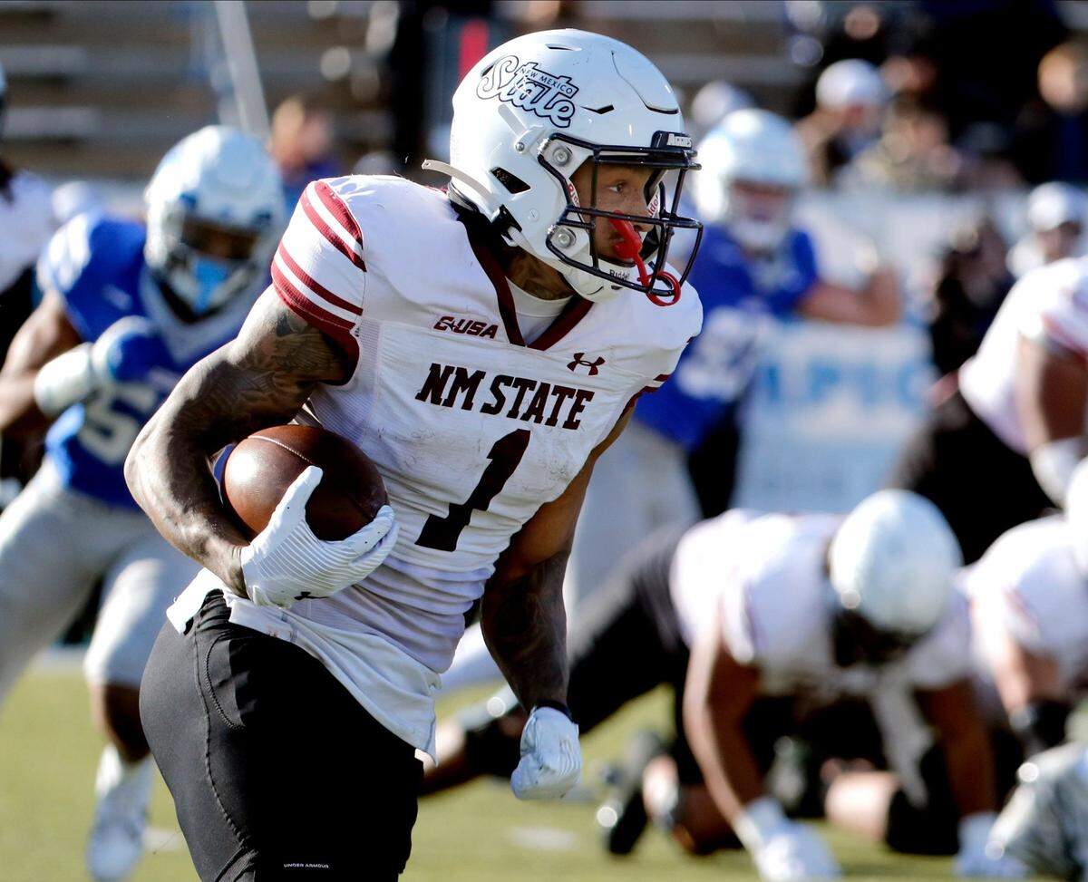 New Mexico State running back Seth McGowan (1) carries the ball during the season final home football game for Middle Tennessee, on Saturday, Nov. 23, 2024.