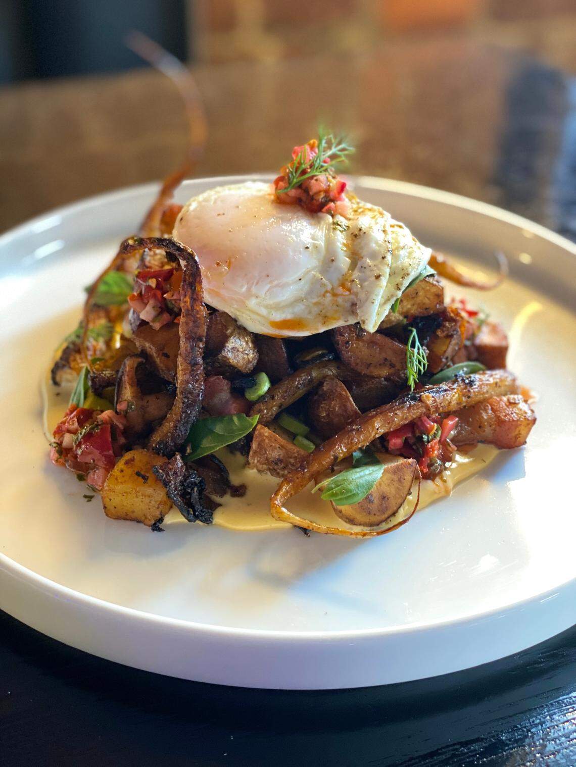 Another item from the ELIXIR Downtown brunch menu: Potato hash with house bacon, Calabrian chili relish, smoked Gouda cream and an over-easy egg.
