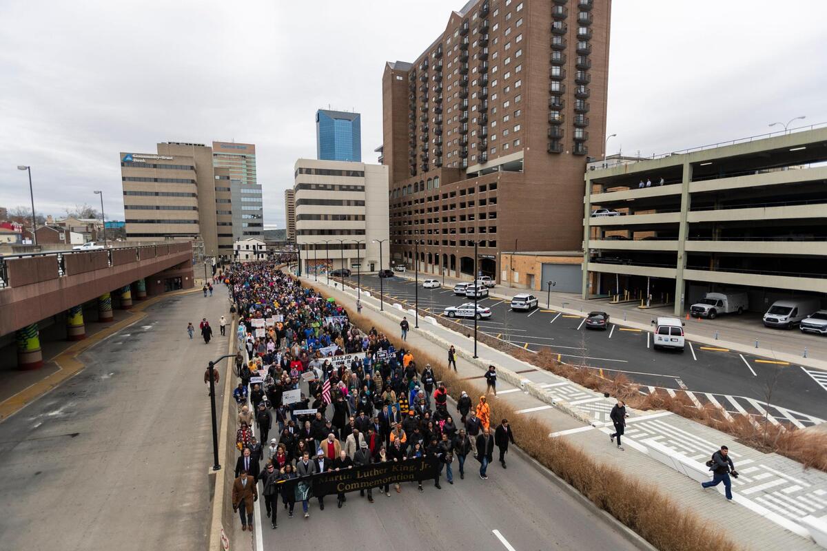 Dr. Eli Capilouto, Dr. David Hall, Mayor Linda Gorton and Gov. Andy Beshear walk at the front of the march during the city’s 50th anniversary of Martin Luther King Jr. celebrations on Vine Street in Lexington, Ky., Monday, January 16, 2023.