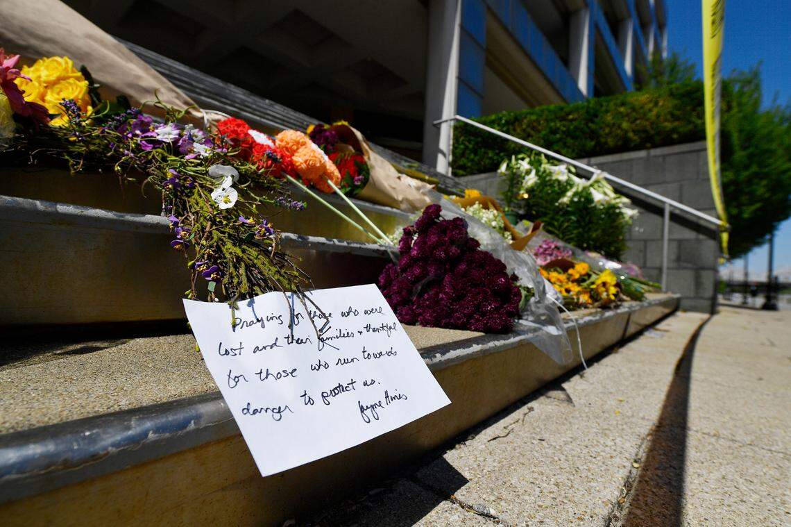 Flowers and a message of hope sat on the steps of the Old National Bank in Louisville, Ky., Tuesday, April 11, 2023, after a shooting killed five people and wounded eight more.