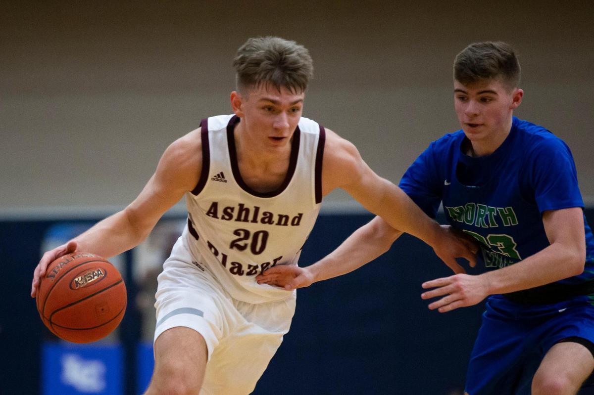 Ashland Blazer’s Cole Villers (20) drove against North Laurel’s Brody Brock (23) on Friday night. Villers finished with 19 points.