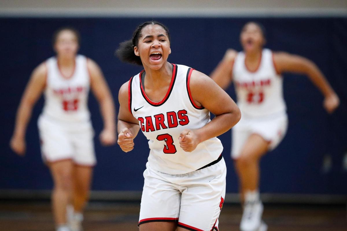 Clark County’s Ciara Byars (3) celebrated with teammates after defeating Southwestern in the championship game of the White, Greer & Maggard Orthodontics Holiday Classic at Lexington Catholic on Tuesday. The Cardinals won 62-61 in overtime.