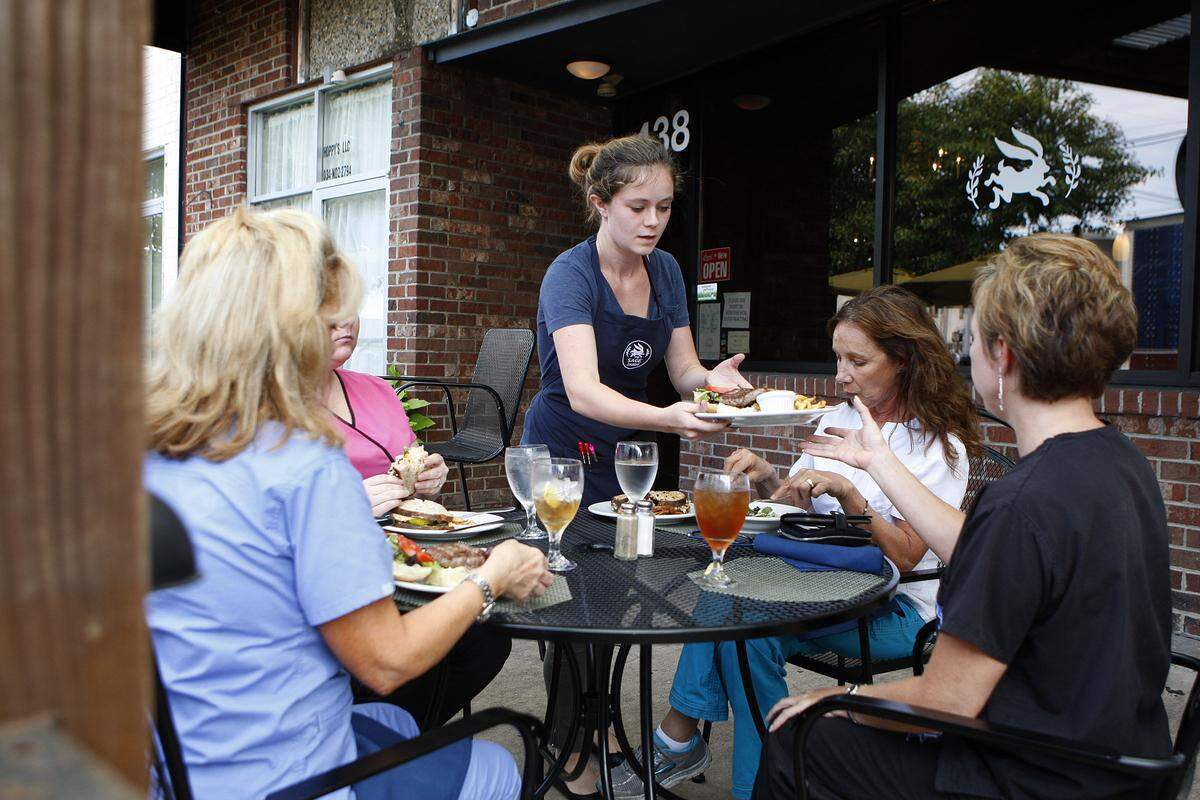 Katy Stroess served diners on the restaurant's porch on South Ashland in Sept. 2015. 