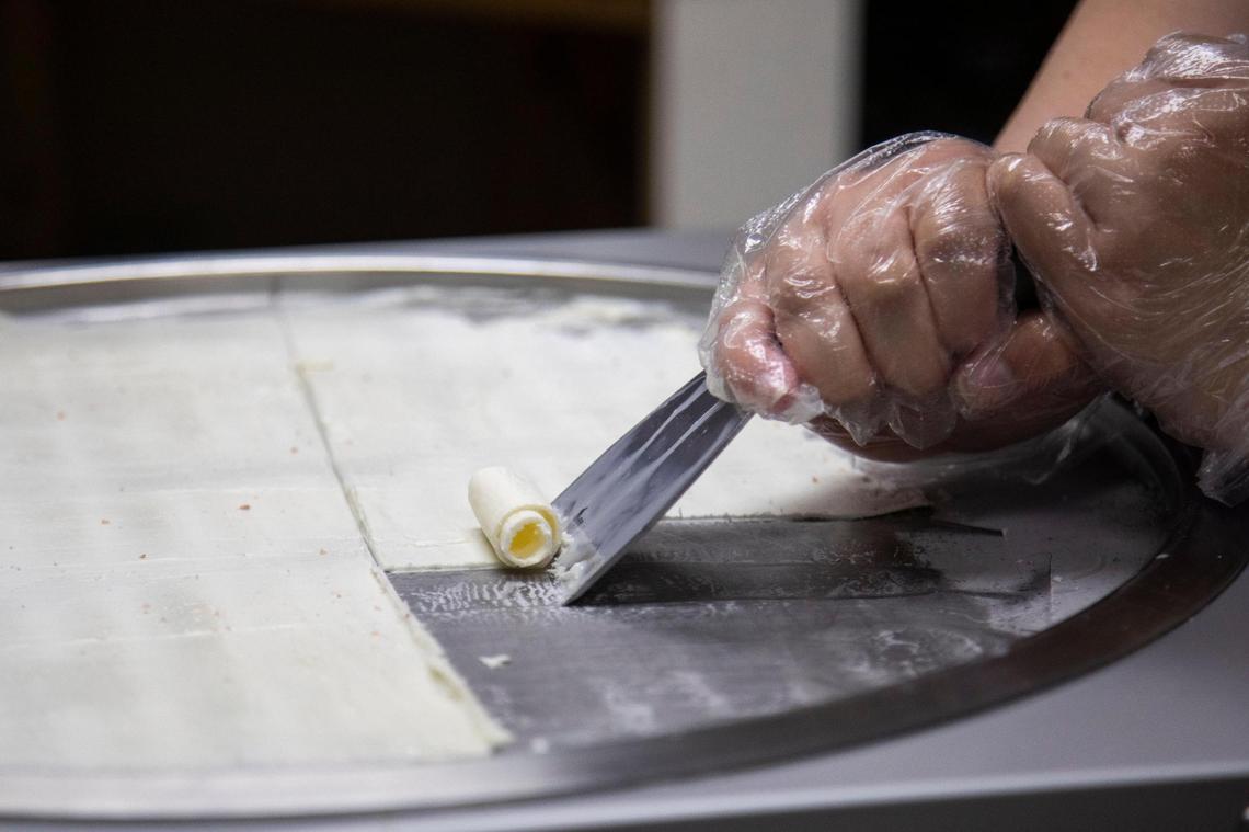 Rolled ice cream is made to order ​on a freezing cold metal sheet at Roll Over Rolled Ice Cream in Morehead.