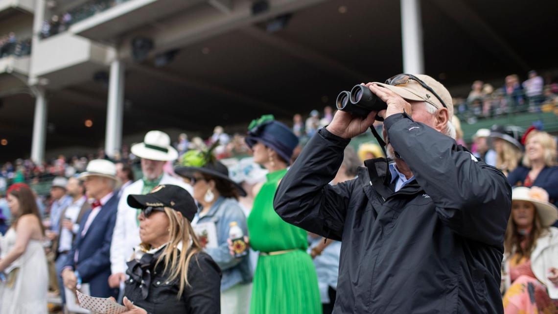 Fans follow undercard races through binoculars before the 148th running of the Kentucky Derby at Churchill Downs in Louisville, Ky., Saturday, May 7, 2022. We’ve rounded up answers to the most-searched Derby questions in the last week.