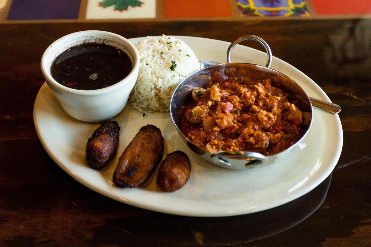 Manita’s Vegadillo plate, a vegetarian version of Havana-style picadillo served by Hola Havana on N Locust Hill Drive, with black bean soup, white rice, tofu, and plantains.