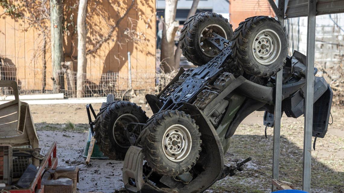 An ATV was flipped over by flood waters on Mullins School Street in Pike County, Ky., Heavy rainfall lead to flooding throughout Kentucky over the weekend.