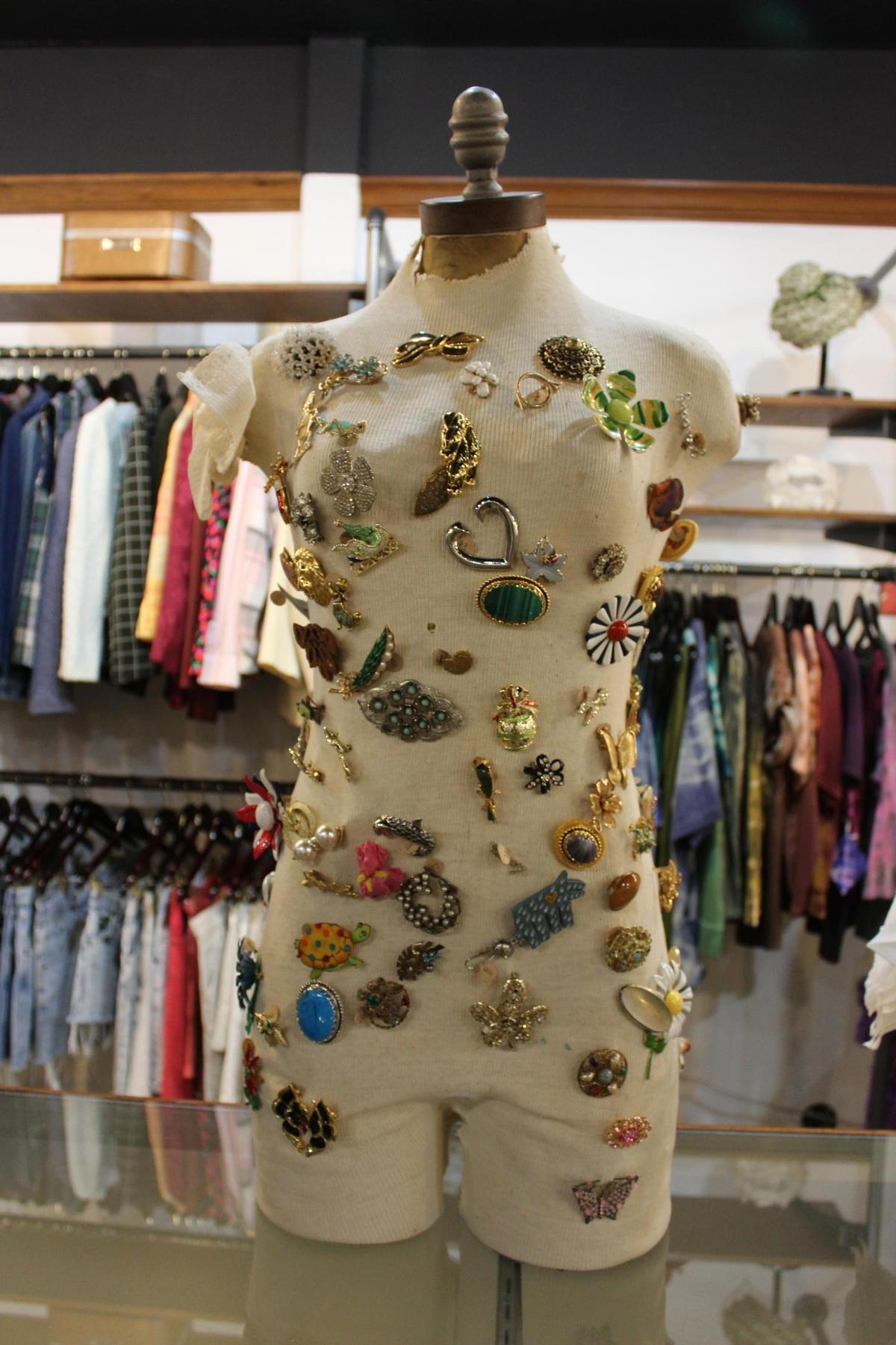 A manequine displays broaches at Street Scene, a vintage store in Lexington, Kentucky.