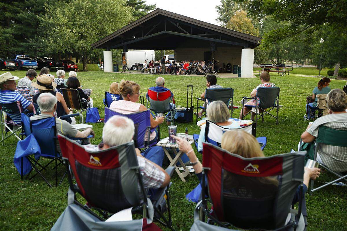 People gather to listen to the Lexington Concert Band during the Big Band & Jazz concert series at Ecton Park in Lexington, Ky., Tuesday, July 10, 2019. Big Band & Jazz will continue at Ecton Park every Tuesday evening at 7 p.m. until Aug. 27.
