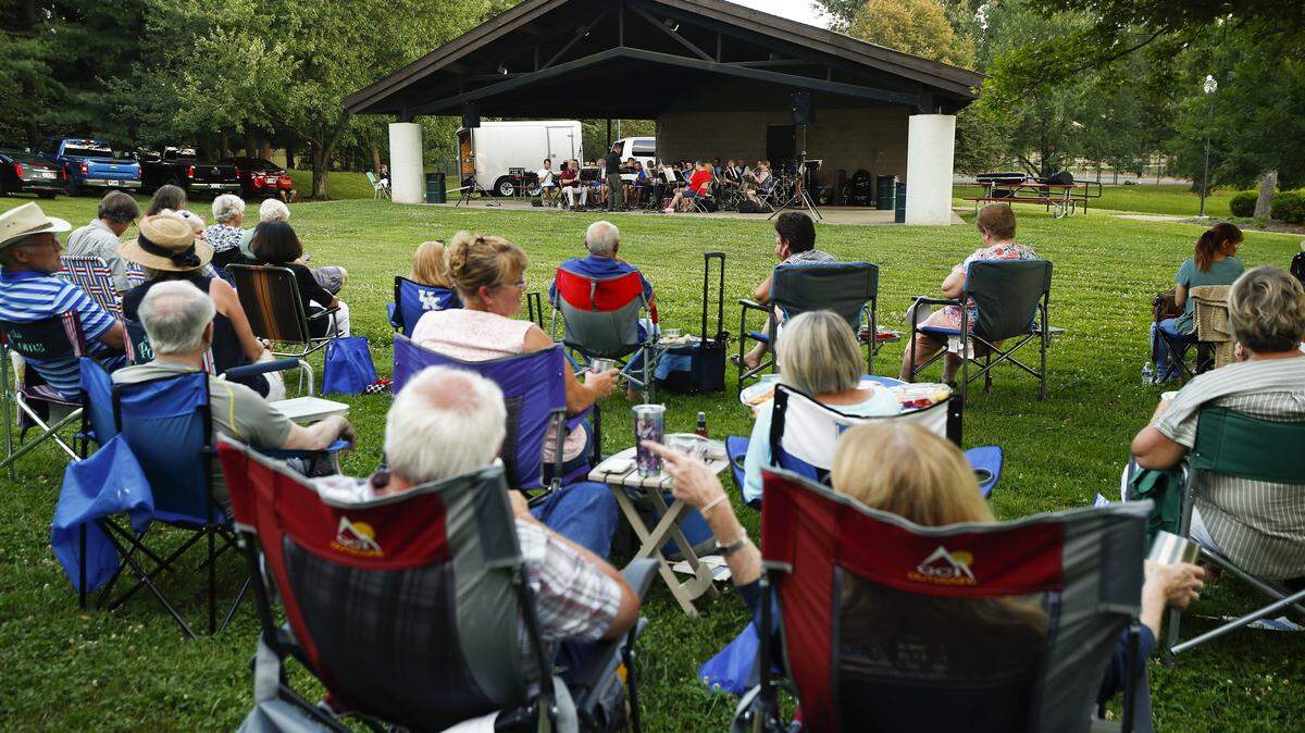 People gather to listen to the Lexington Concert Band during the Big Band & Jazz concert series at Ecton Park in Lexington, Ky., Tuesday, July 10, 2019. Big Band & Jazz will return to Ecton Park every Tuesday evening at 7 p.m. July 6-Aug. 17.
