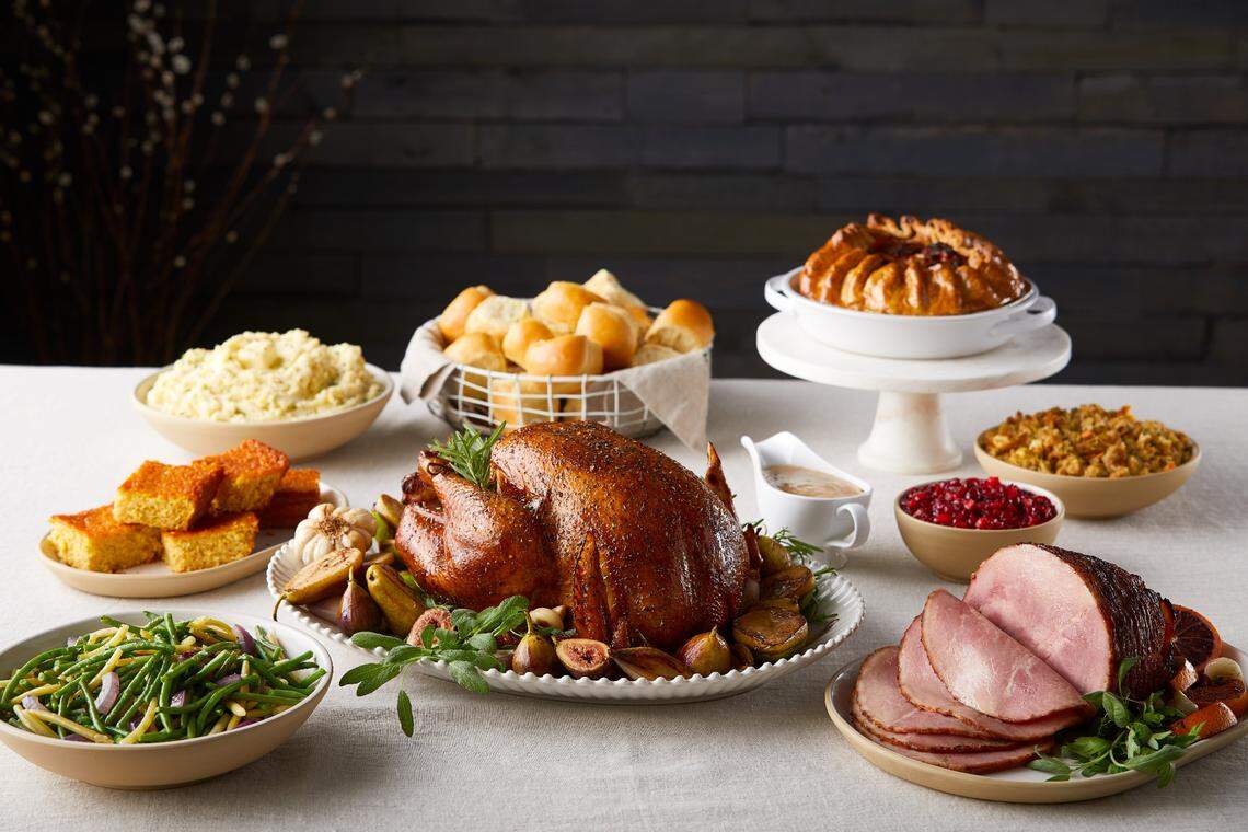 The Ultimate Holiday Meal from The Fresh Market feeds 12-14 $159.99 and includes a fully cooked turkey, boneless sliced ham, Yukon Gold whipped potatoes, herb stuffing, gravy, corn souffle, green bean medley, cranberry relish with walnuts, rolls and apple pie.