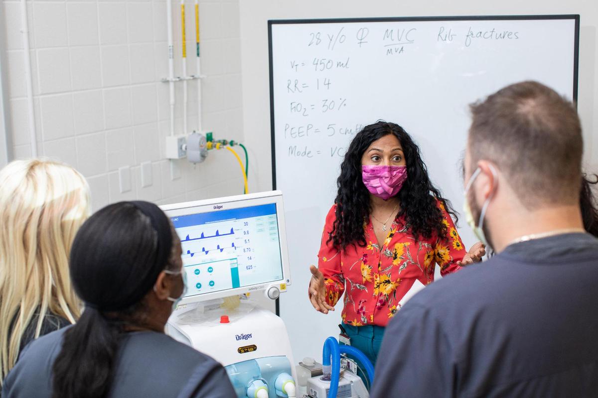 Professor Trisha Dang talks with respiratory care students working through situations with a ventilator at BCTC in Lexington, Ky., Wednesday, October 6, 2021.