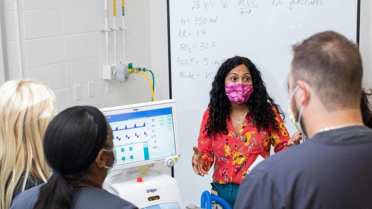 Professor Trisha Dang talks with respiratory care students working through situations with a ventilator at BCTC in Lexington, Ky., Wednesday, October 6, 2021.