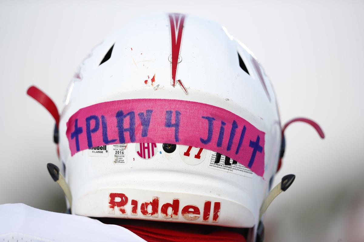 Anderson County’s Huntley Chilton (77) wears pink tape on his helmet during a “pink out” in memory of Jill Hurst, a recent Anderson County High School graduate who died after being involved in a car accident with a man who was being chased by police at Franklin County High School in Frankfort, Ky., Friday, Sept. 13, 2019.
