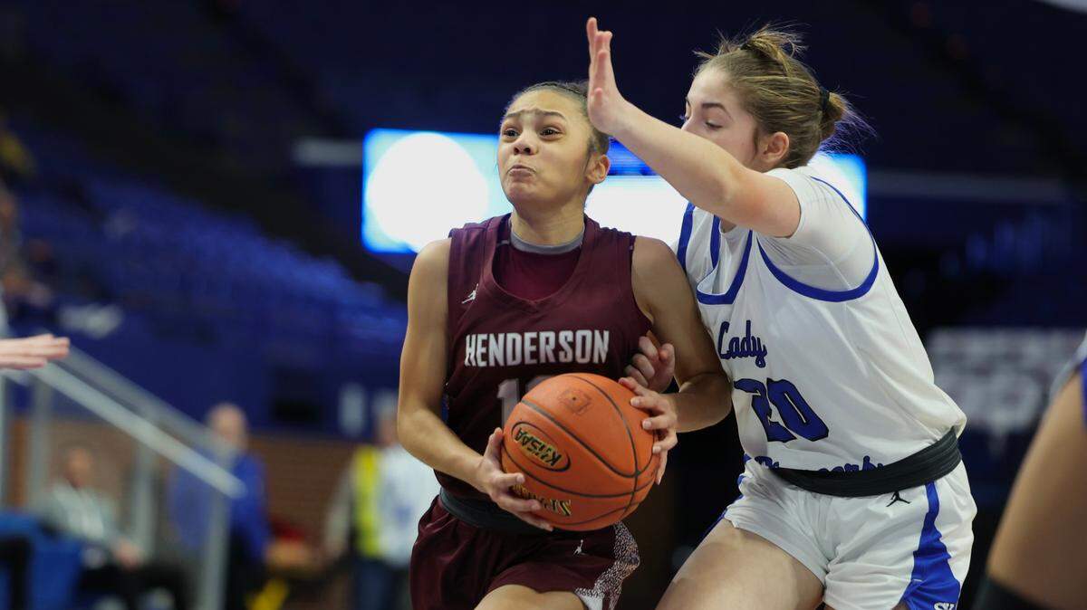 Henderson County’s Shalyn Sprinkles (12) operates against Simon Kenton’s Bella Ober during Thursday night’s overtime game in Rupp Arena.