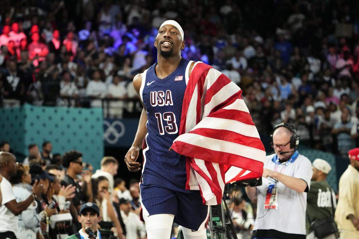 Aug 10, 2024; Paris, France; United States centre Bam Adebayo (13) celebrates after defeating France in the men's basketball gold medal game during the Paris 2024 Olympic Summer Games at Accor Arena. Mandatory Credit: Rob Schumacher-USA TODAY Sports