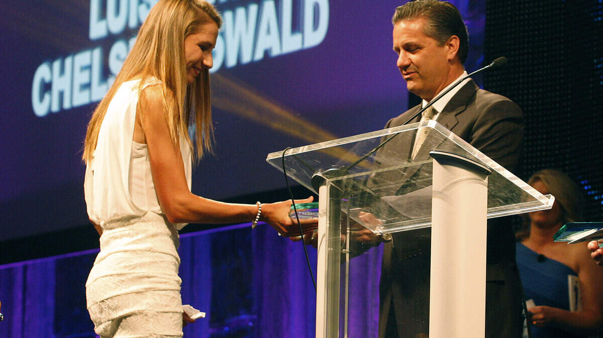 Chelsea Oswald accepted the Miss Wildcat Award from Coach John Calipari during the CATSPY Awards on Monday. Photo by Matt Goins