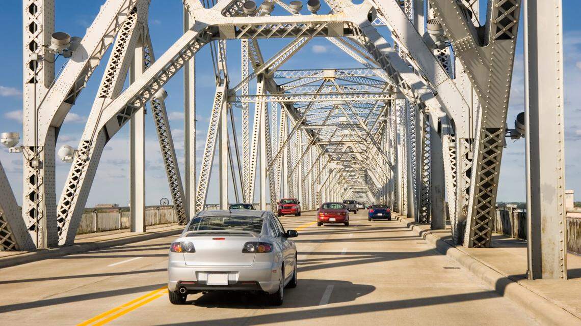 Traffic crossing an interstate highway four lane on a bridge over the Ohio River, Louisville, Kentucky, USA.