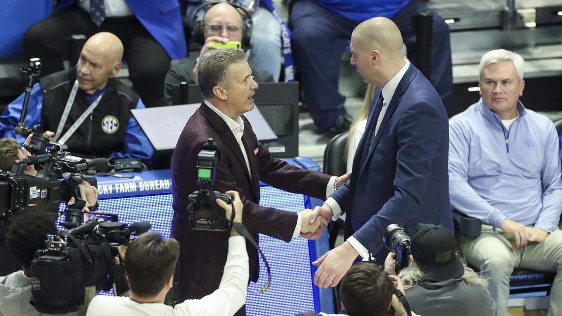 Arkansas coach John Calipari greeted Kentucky head man Mark Pope after the Razorbacks beat the Wildcats 89-79 last season at Rupp Arena.