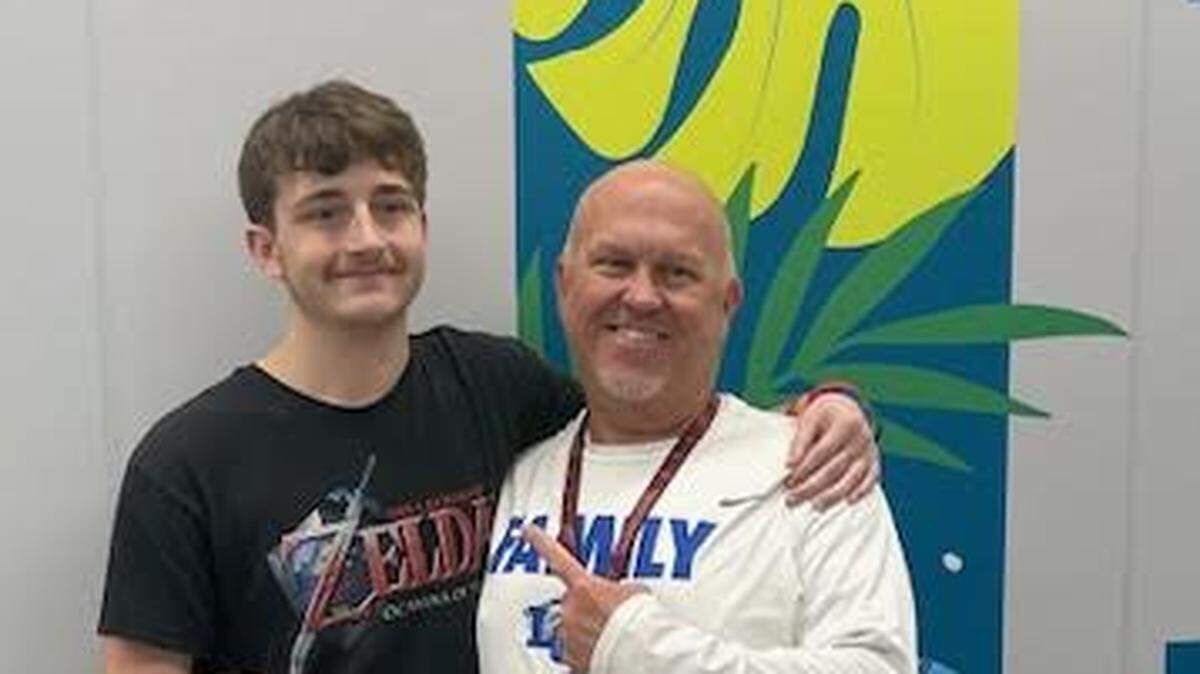 Fayette County’s Success Academy Teacher William Trent Hamlin, right, helped Gabriel Mann obtain enough high school credits to graduate.