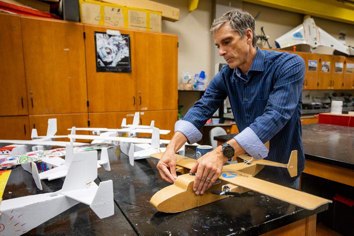 Sean Bailey, UK mechanical and aerospace engineering professor, puts together a drone model that students had built on Monday, July 14, 2025, at the University of Kentucky campus in Lexington, Ky.