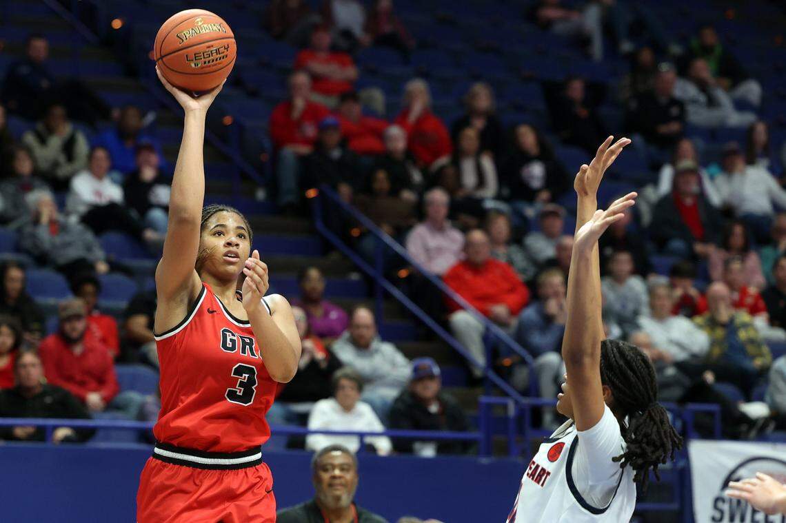 Ciara Byars (3) shoots over Sacred Heart’s ZaKiyah Johnson (11) during last year’s Girls’ Sweet 16 in Rupp Arena. Both players are among the nation’s top recruits in the class of 2025.