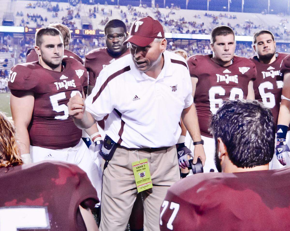 John Schlarman coached the offensive line at Troy University for six seasons (2007-2012) before he came to Kentucky. New UK offensive line coach Zach Yenser was a graduate assistant under Schlarman at Troy in 2007.
