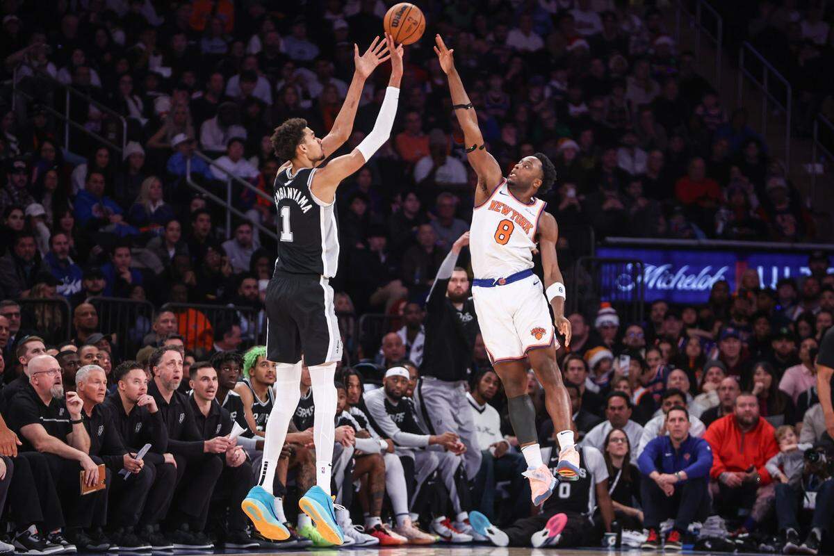 Spurs center Victor Wembanyama (1) takes a 3-point shot against Knicks forward OG Anunoby (8) on Dec. 25 at Madison Square Garden.