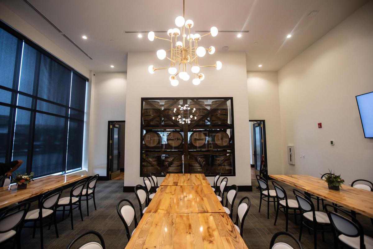 A private dining room with a bourbon barrel display behind a glass case at the 33 Staves restaurant located within the Origin Hotel in Lexington, which opened to the public on July 22, 2019.