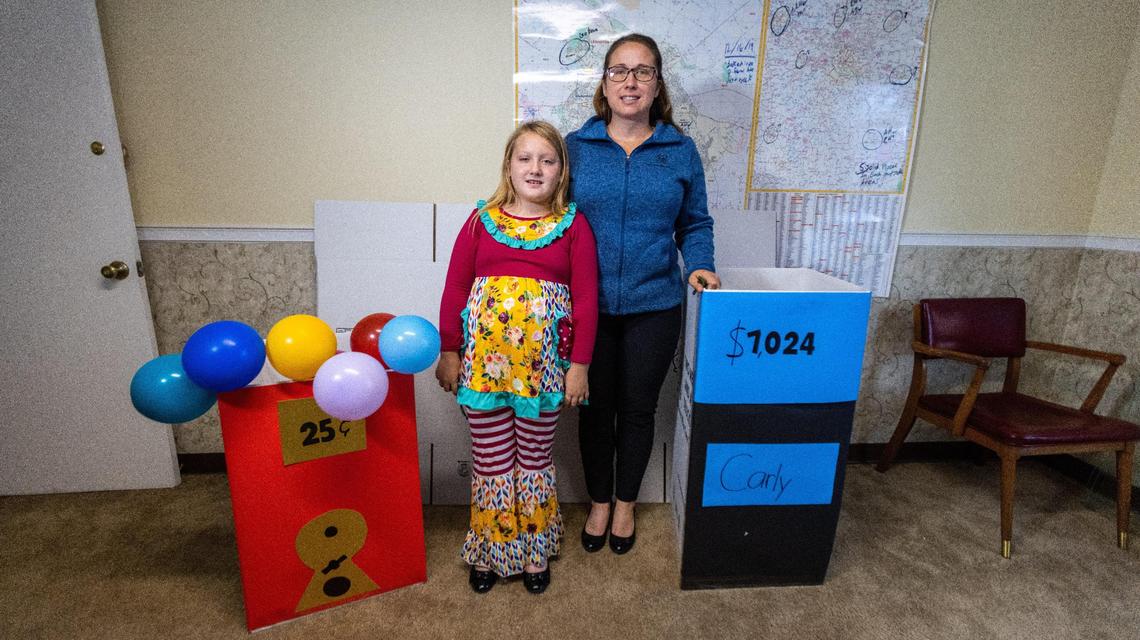 Jennifer Klinglesmith with her 8-year-old daughter, Carly, with themed Halloween costumes repurposed from cardboard boxes called “Boxtumes.”