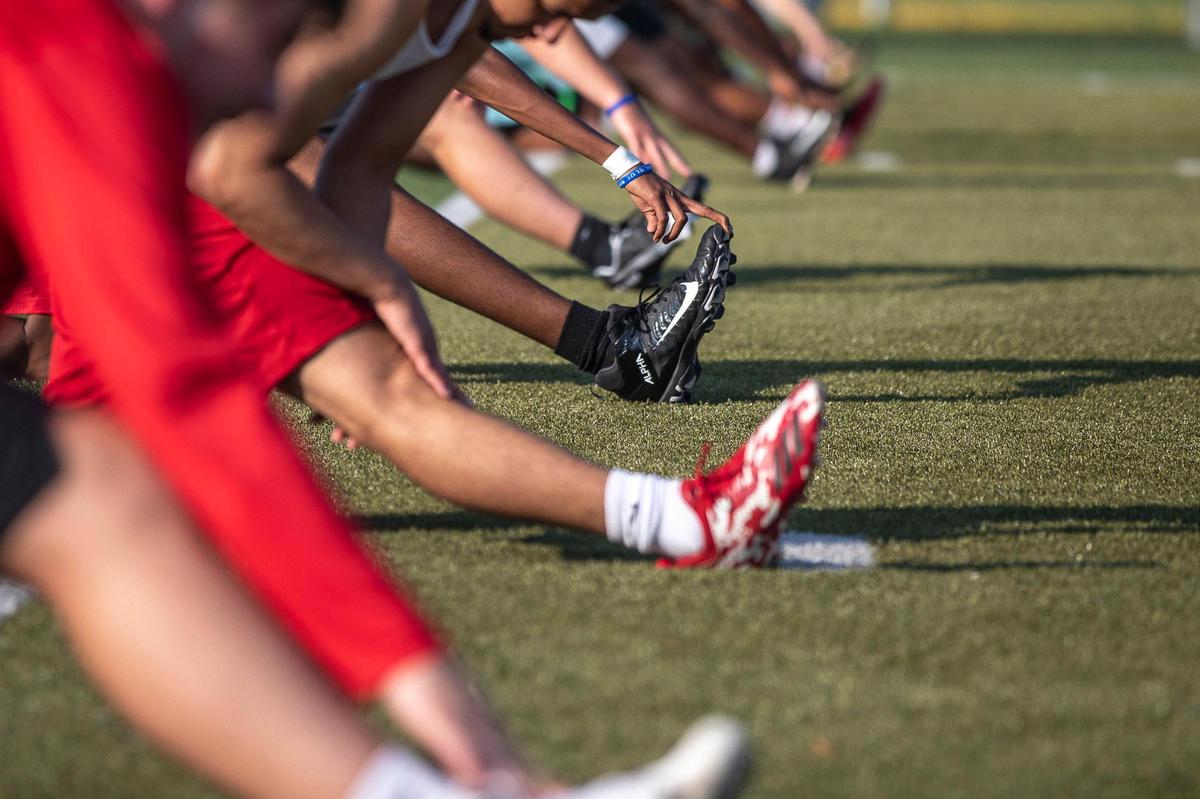 Members of the Paul Laurence Dunbar High School football team took part in a voluntary workout this month. Since voluntary workouts began June 29 in Fayette County, 7,000 athletes have participated and only six have tested positive for COVID-19.