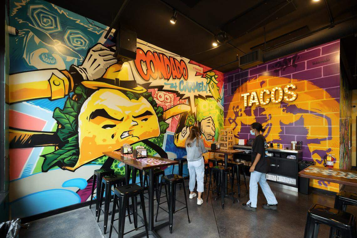 Each Condado Tacos restaurant features floor-to-ceiling murals done in part by local artists, incorporating local landmarks and themes.