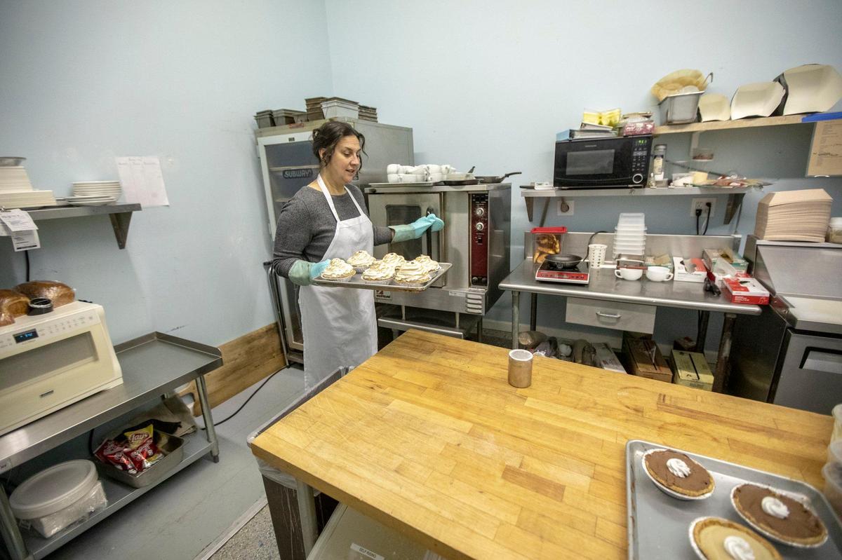 Danielle King, owner of Spoonful of Sugar, Sweets and Such, works in the establishment’s kitchen in Mt. Sterling. King started the business with Donna Cassidy, the two had worked at a Mt. Stearling clinic.