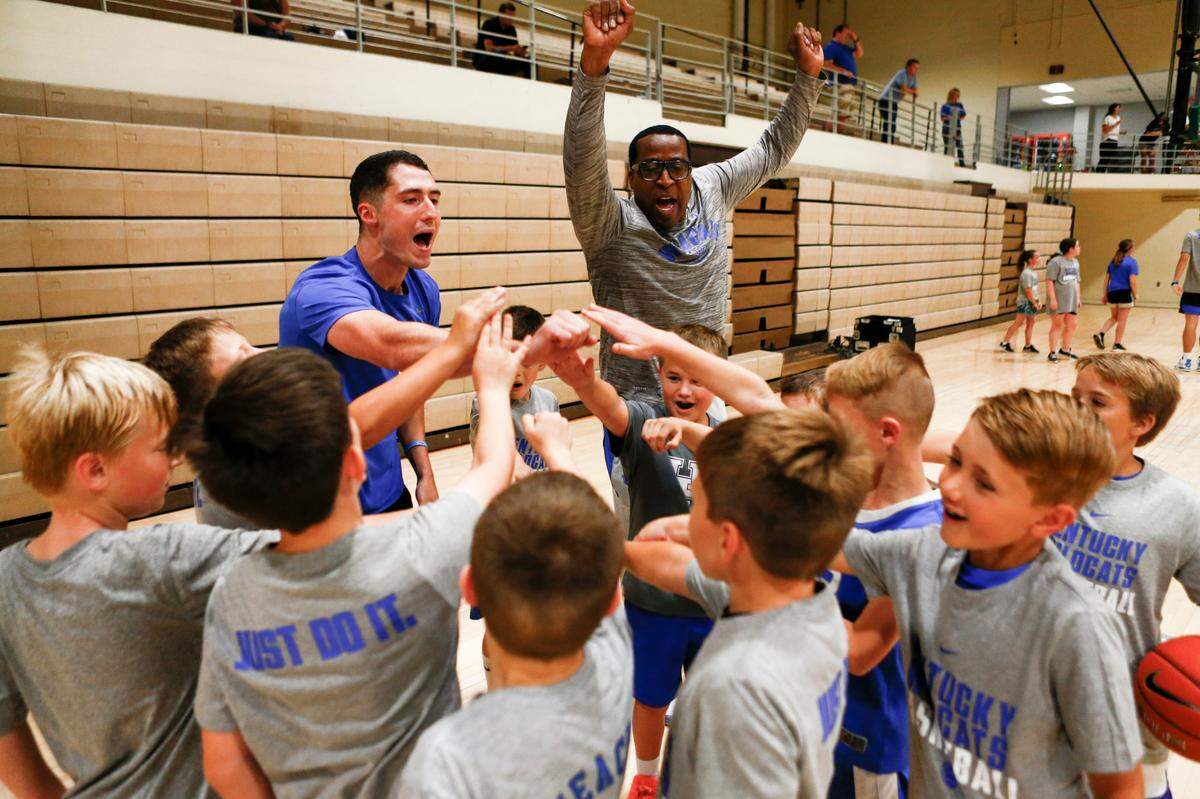 Kentucky graduate assistant Kevin Gallagher, left, and assistant coach Chin Coleman interacted with participants at the men’s basketball team’s camp at South Oldham High School in Crestwood on June 10.