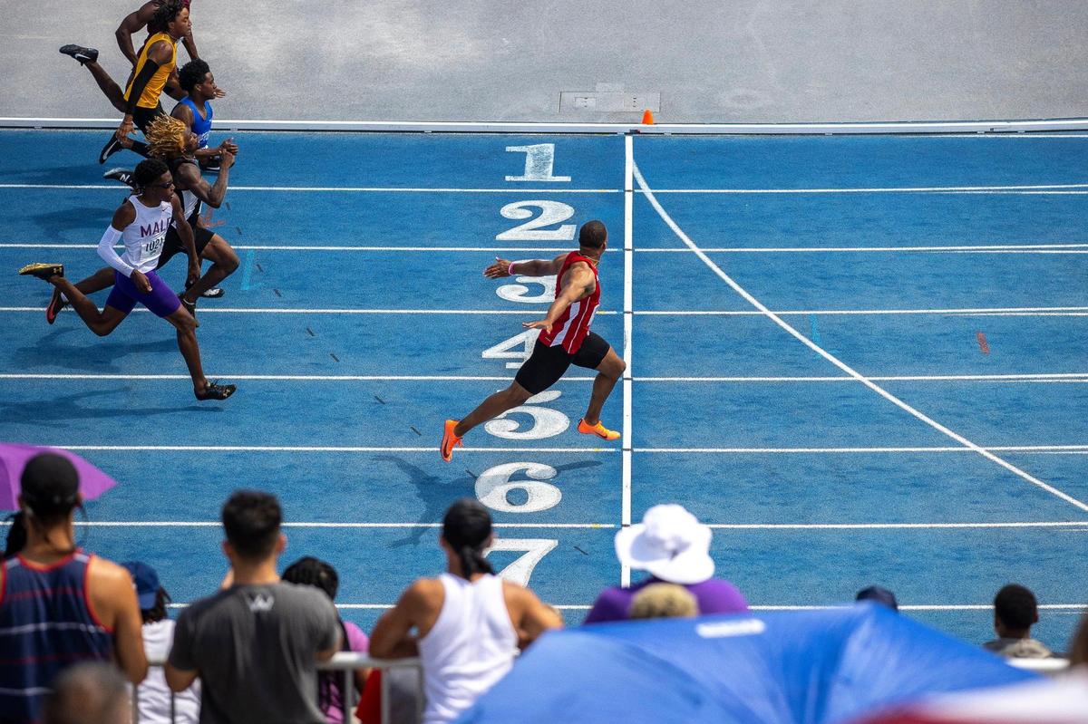“I crossed the finish line, and I usually don’t celebrate, but I was like, ‘Oh! Okay,’ and it just came out,” said Scott County’s Bryce Chisley (right). “It was a really good day, all in all.”