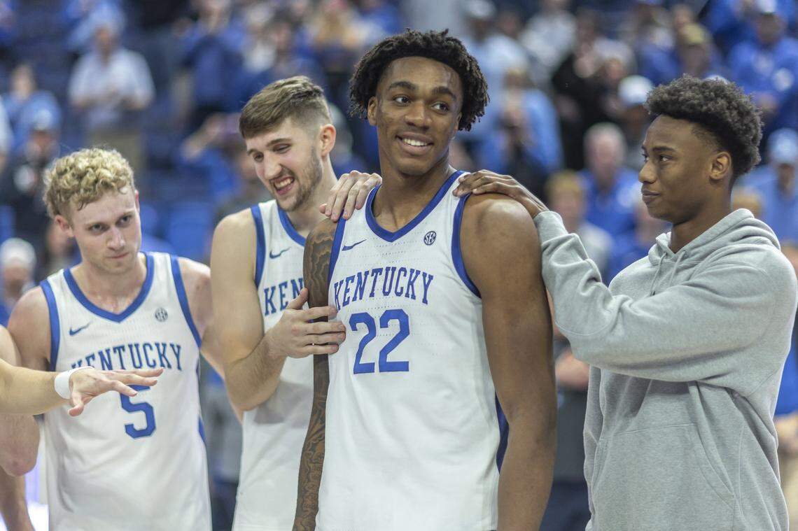 Kentucky center Amari Williams is surrounded by teammates, from left, Collin Chandler, Andrew Carr and Jaxson Robinson, following the team’s game against the LSU Tigers on March 4.