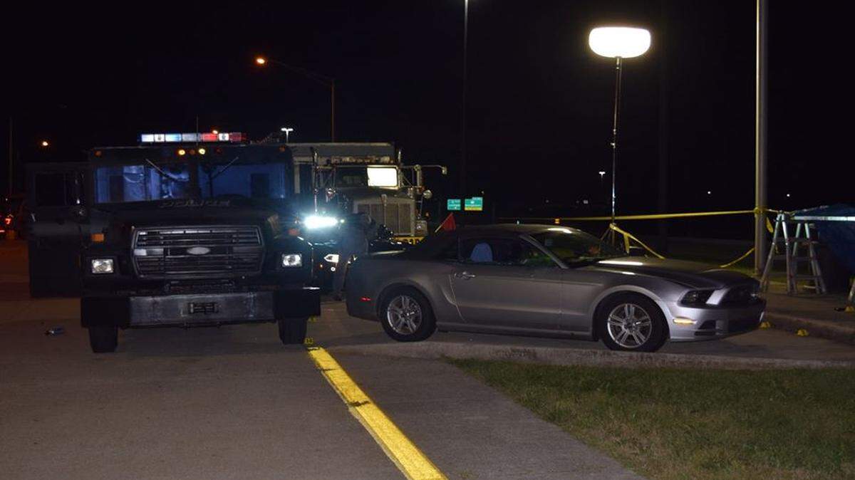 A special-response team vehicle blocked the back of the silver Mustang driven by bank robbery suspect Edward Reynolds when police tried to apprehend him at a rest area on Interstate 75 northbound, just north of Georgetown, on Sept. 11, 2018. Reynolds was shot multiple times in the confrontation and Scott County sheriff’s deputy Jaime Morales was paralyzed.